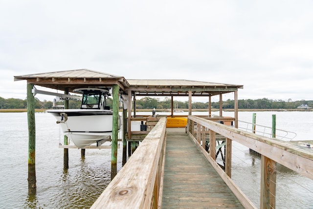 view of dock with a water view and boat lift