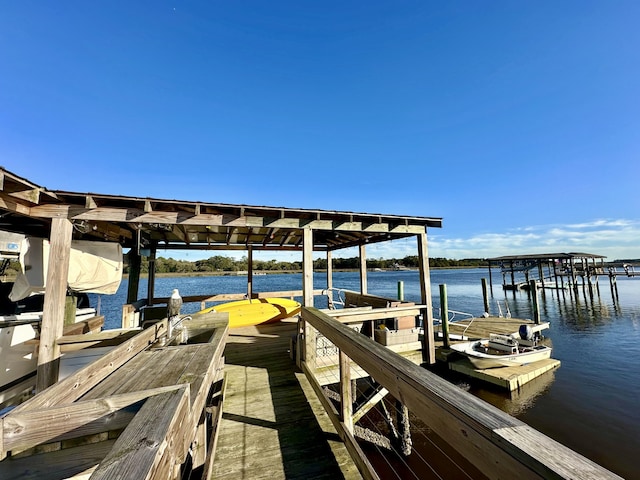 view of dock with a water view and boat lift