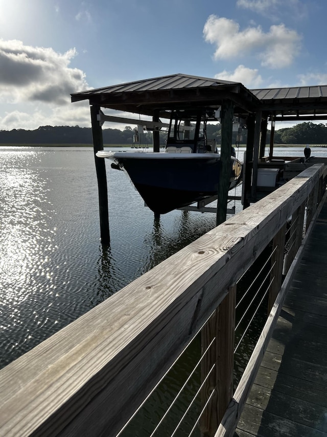 dock area featuring a water view and boat lift