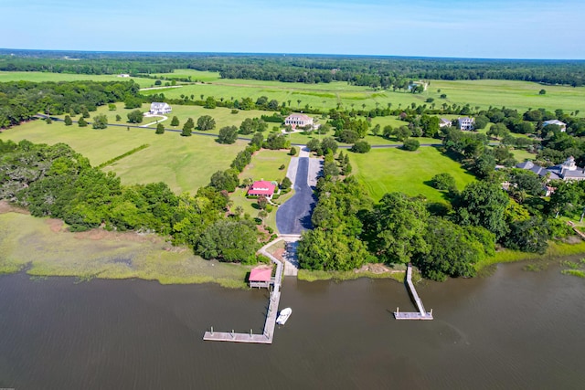 drone / aerial view with a water view and a rural view