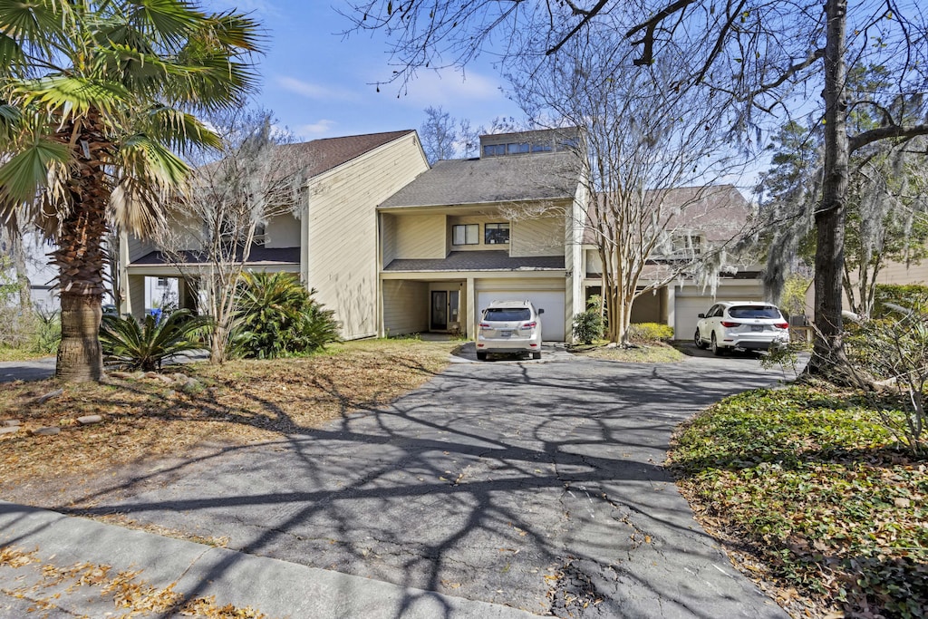 view of front of property with aphalt driveway and an attached garage