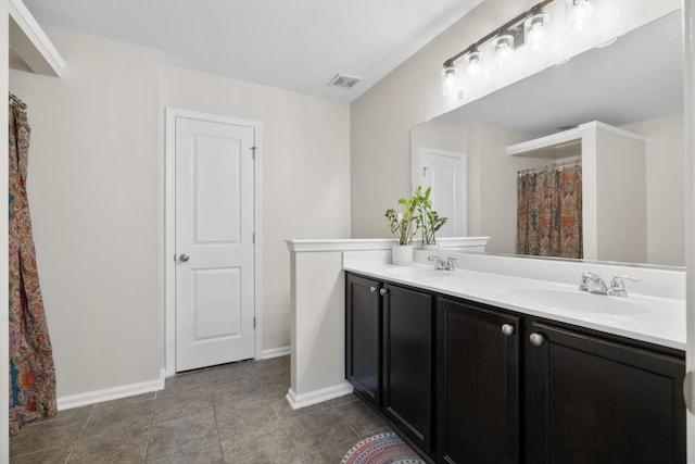826 Bibury Ct, Charleston, SC 29414 - bathroom featuring double vanity, baseboards, and tile patterned flooring