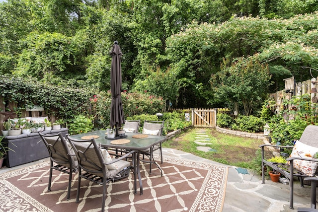 826 Bibury Ct, Charleston, SC 29414 - view of patio featuring outdoor dining area and a gate