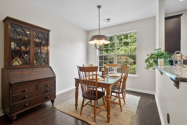826 Bibury Ct, Charleston, SC 29414 - dining space featuring baseboards, dark wood-type flooring, and a chandelier