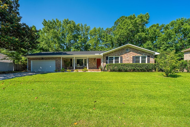 2847 Limestone Blvd, Charleston, SC 29414 - single story home with asphalt driveway, a garage, a front yard, and brick siding