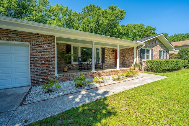 2847 Limestone Blvd, Charleston, SC 29414 - single story home featuring a porch, brick siding, a front yard, and an attached garage