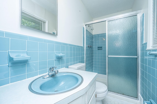 2847 Limestone Blvd, Charleston, SC 29414 - full bathroom featuring tile walls, a stall shower, vanity, tile patterned floors, and wainscoting
