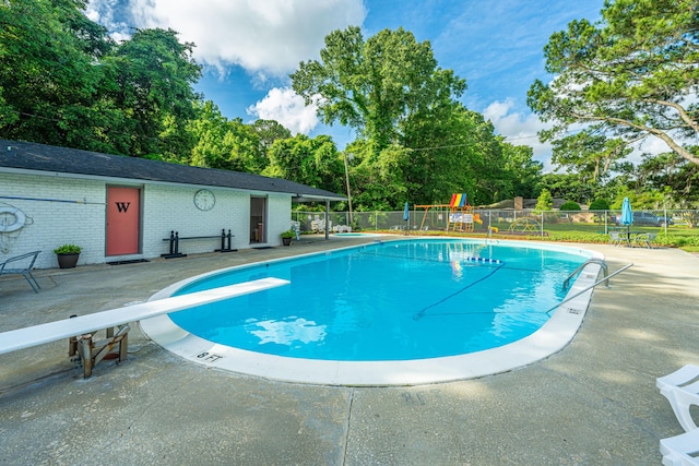 2847 Limestone Blvd, Charleston, SC 29414 - community pool with a diving board, a patio area, and view of wooded area