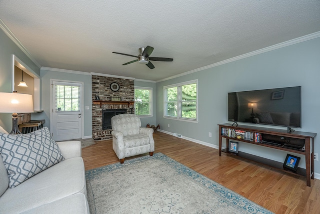 2847 Limestone Blvd, Charleston, SC 29414 - living room with wood finished floors, ornamental molding, a ceiling fan, plenty of natural light, and a textured ceiling