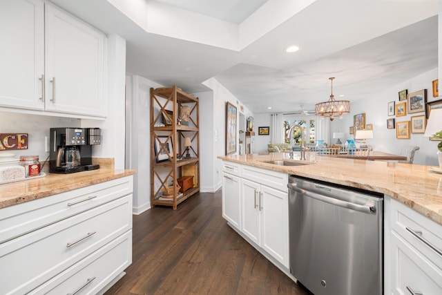 kitchen featuring decorative light fixtures, sink, white cabinets, dark hardwood / wood-style flooring, and stainless steel dishwasher