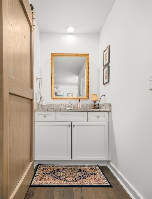 bathroom featuring vanity and hardwood / wood-style floors