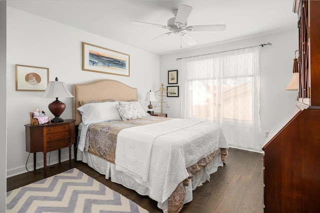 bedroom featuring ceiling fan and dark hardwood / wood-style floors