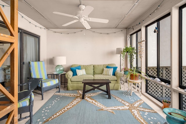 sunroom featuring ceiling fan