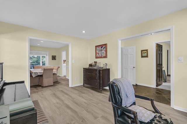 office area with light wood-style flooring, recessed lighting, and baseboards