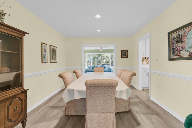 dining room with wood finished floors, baseboards, and recessed lighting