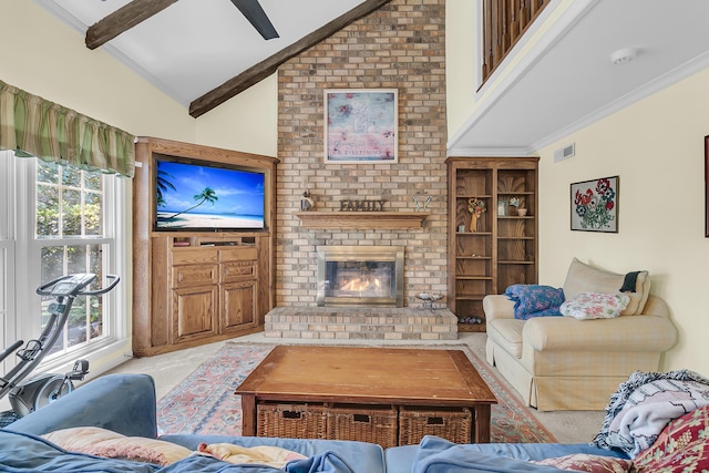 carpeted living area featuring crown molding and a fireplace