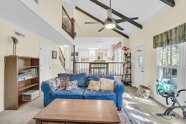 living room with ceiling fan, carpet flooring, high vaulted ceiling, stairway, and baseboards