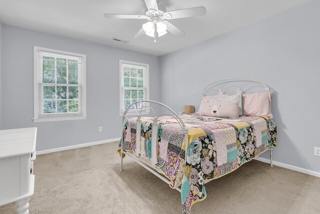 bedroom featuring carpet floors, baseboards, and ceiling fan