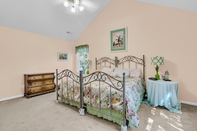 carpeted bedroom with baseboards and high vaulted ceiling