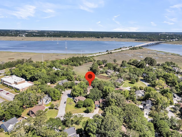 aerial view of property's location featuring a nearby body of water and a notable bridge