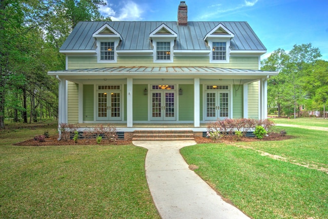 view of front of home with french doors, metal roof, and a standing seam roof