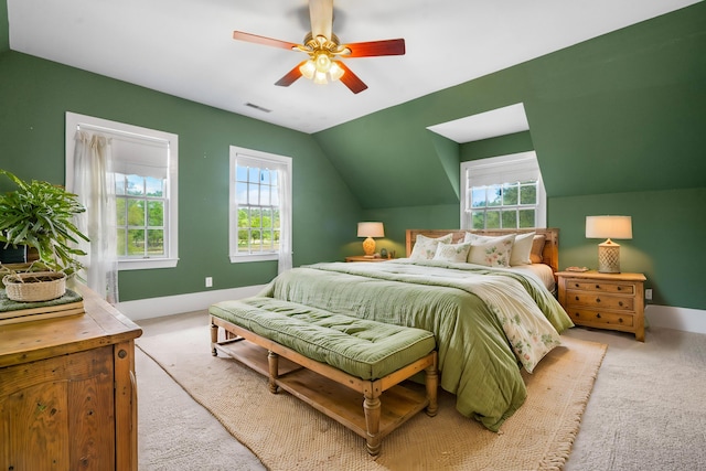 carpeted bedroom featuring visible vents, ceiling fan, baseboards, and lofted ceiling