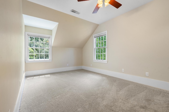 bonus room featuring visible vents, baseboards, ceiling fan, carpet floors, and vaulted ceiling