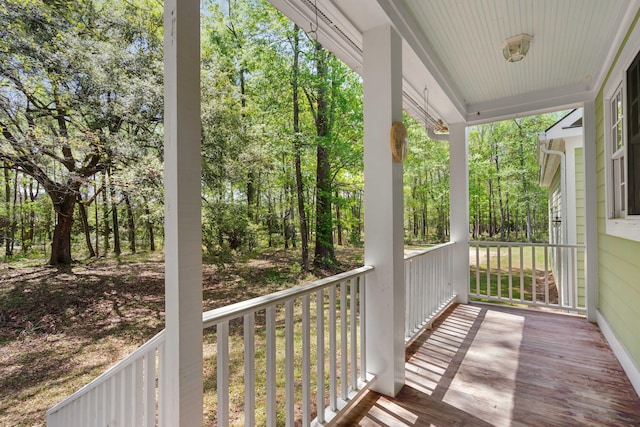 wooden terrace featuring covered porch