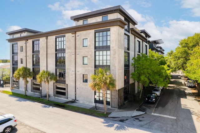 1 Cool Blow St Unit 124, Charleston, SC 29403 - view of building exterior with uncovered parking