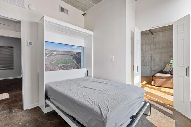 1 Cool Blow St Unit 124, Charleston, SC 29403 - bedroom with concrete floors