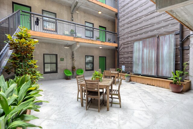 1 Cool Blow St Unit 124, Charleston, SC 29403 - view of patio featuring a balcony and outdoor dining space