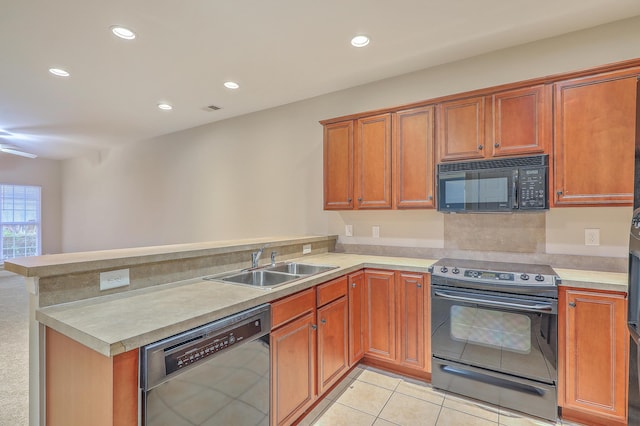 kitchen with sink, kitchen peninsula, light tile patterned flooring, electric range, and stainless steel dishwasher