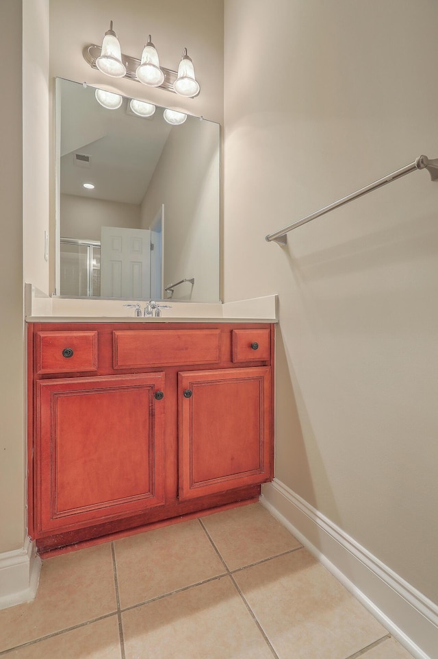 bathroom with vanity and tile patterned flooring