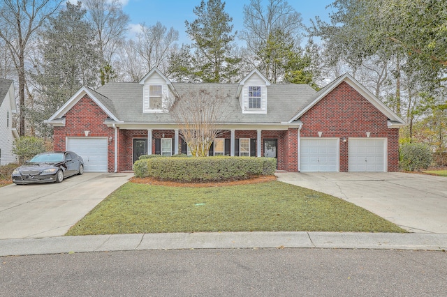 view of front of home with a garage and a front lawn