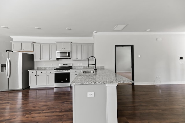 kitchen featuring stainless steel appliances, crown molding, a sink, a peninsula, and light stone countertops
