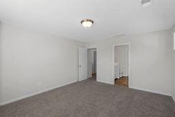 unfurnished bedroom with carpet flooring