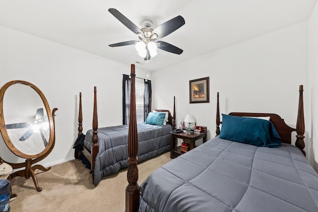 bedroom featuring light carpet and ceiling fan