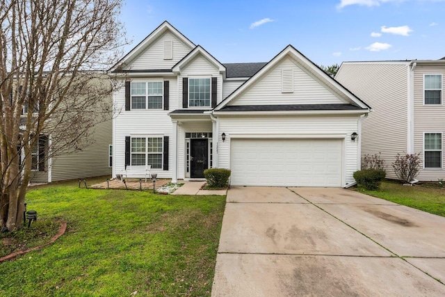 traditional-style home featuring driveway, an attached garage, a shingled roof, and a front yard