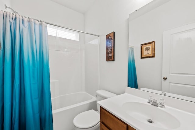 bathroom featuring shower / tub combo with curtain, vanity, and toilet