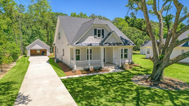 view of front of property featuring covered porch, a shingled roof, a front yard, and a standing seam roof