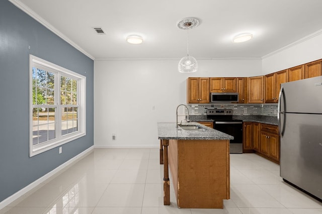 kitchen featuring tasteful backsplash, sink, hanging light fixtures, appliances with stainless steel finishes, and ornamental molding