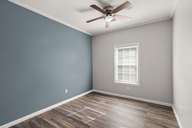 empty room with ceiling fan, crown molding, and hardwood / wood-style floors