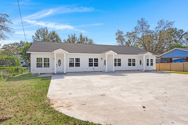 ranch-style house with a front lawn