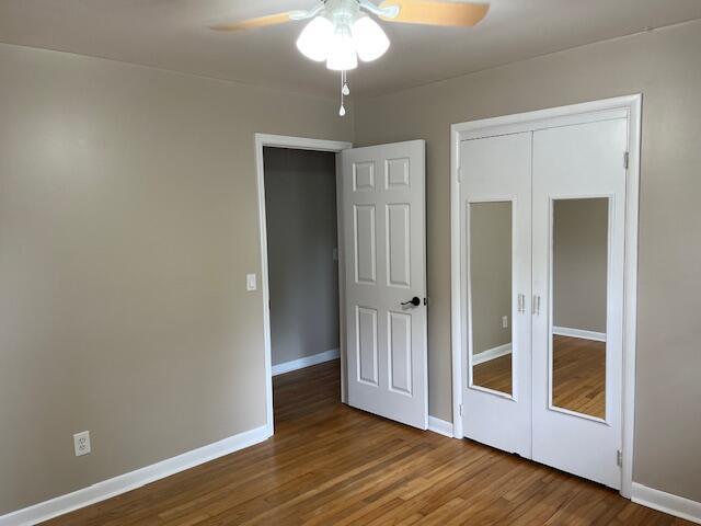 105 Pandora Dr, Goose Creek, SC 29445 - unfurnished bedroom with wood finished floors, baseboards, a closet, and ceiling fan