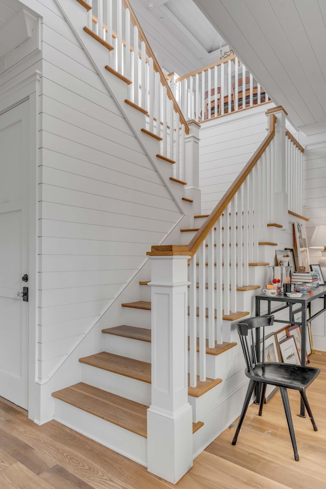 staircase featuring wood-type flooring