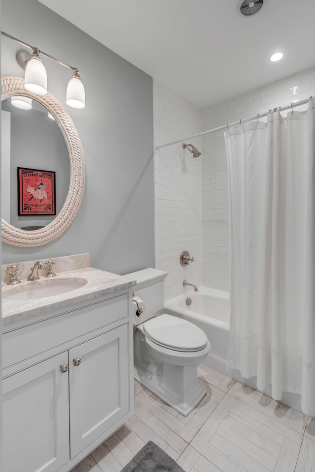 full bathroom featuring vanity, toilet, and shower / bath combo with shower curtain