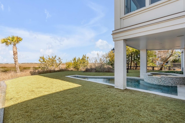 view of yard featuring an in ground hot tub