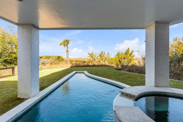 view of pool featuring a lawn