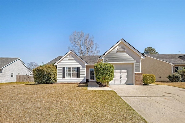 single story home featuring a front lawn, fence, concrete driveway, an attached garage, and brick siding