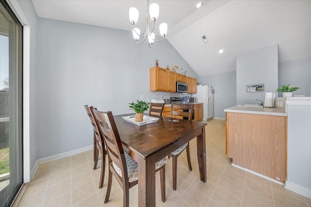 dining room featuring vaulted ceiling, a notable chandelier, baseboards, and light tile patterned floors